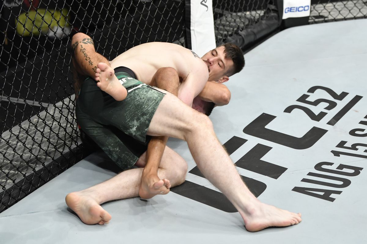 Joel Alvarez of Spain secures a guillotine choke submission against Joe Duffy of Ireland in their lightweight bout during the UFC Fight Night event inside Flash Forum on UFC Fight Island on July 19, 2020 in Yas Island, Abu Dhabi, United Arab Emirates.