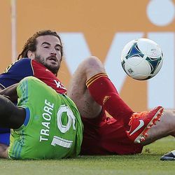 Real Salt Lake midfielder Kyle Beckerman (5) gets tangled up with Seattle defender Djimi Traore (19) during an MLS game between Real Salt Lake and Seattle on Saturday, June 22, 2013 at Rio Tinto Stadium. RSL beat the Sounders 2-0.