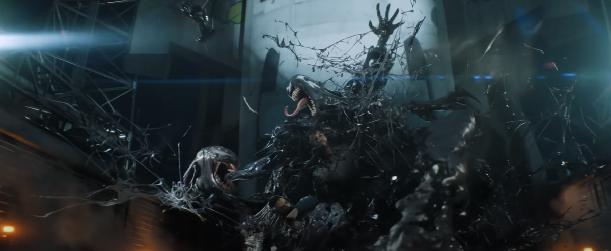 A cartoonish looking fight scene between Venom and Riot