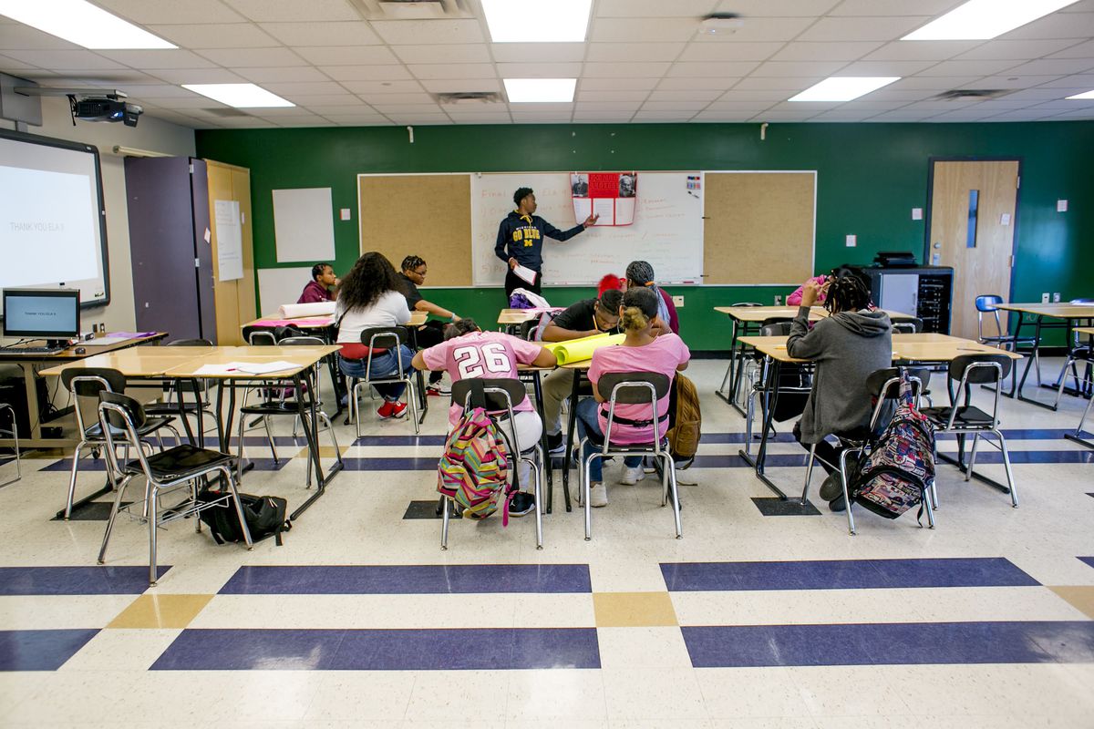 A teacher instructs students in an English class at Southeastern High School in Detroit in June 2019.
