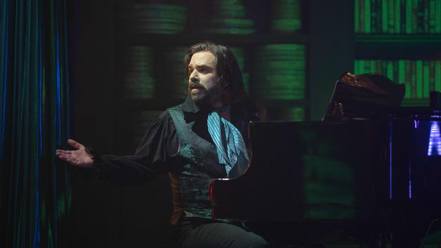 Matt Berry plays the piano as Laszlo in What We Do in the Shadows.