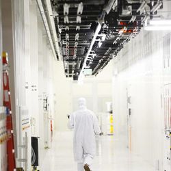 An IM Flash Technologies engineer works in the clean room where memory is manufactured in Lehi Friday, Feb. 20, 2015. 