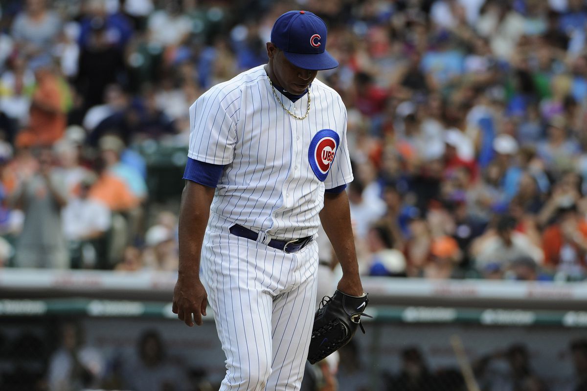Carlos Marmol of the Chicago Cubs walks of the mound after giving up the go ahead runs against the San Francisco Giants at Wrigley Field in Chicago, Illinois. (Photo by David Banks/Getty Images)