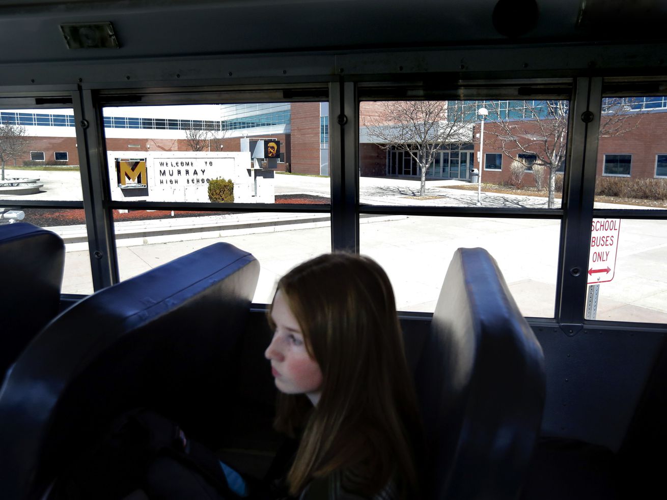 Sophomore Zoe Scott waits for her bus to leave Murray High School on Thursday, March 12, 2020. Murray City School District announced Thursday it is closing its schools until further notice amid spread of the novel coronavirus in Utah. Most students and teachers left school after the announcement was made earlier in the day.