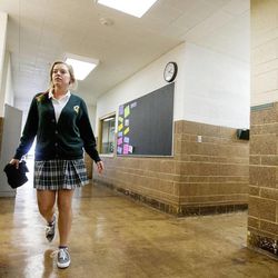 Amanda Higgs, a senior at St. Joseph Catholic High School in Ogden, walks to a work room Wednesday, Oct. 1, 2014, between classes.