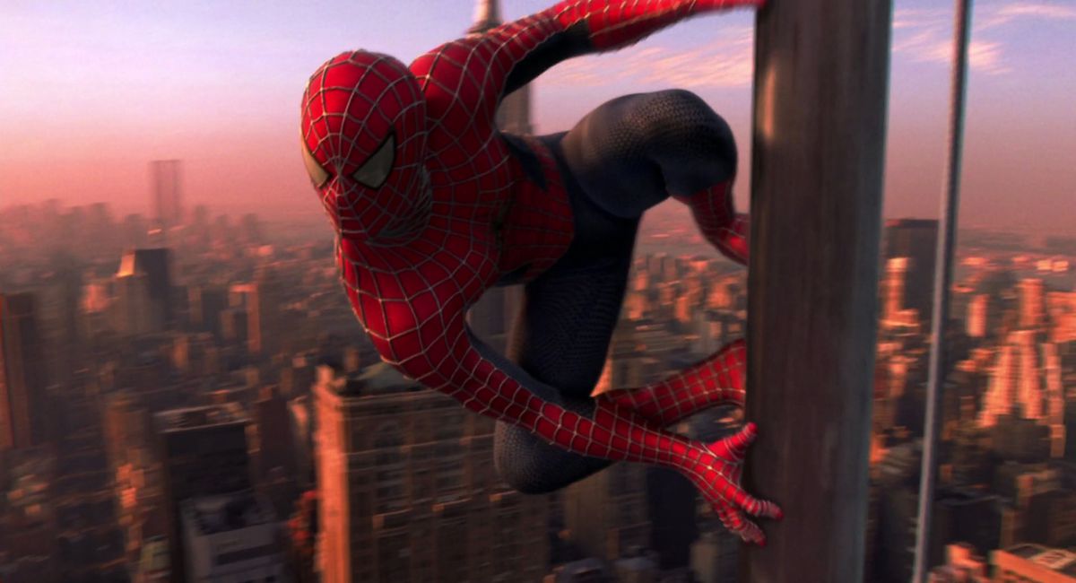 Spider-Man hanging off a skyscraper in new york from the 2002 Sam Raimi movie
