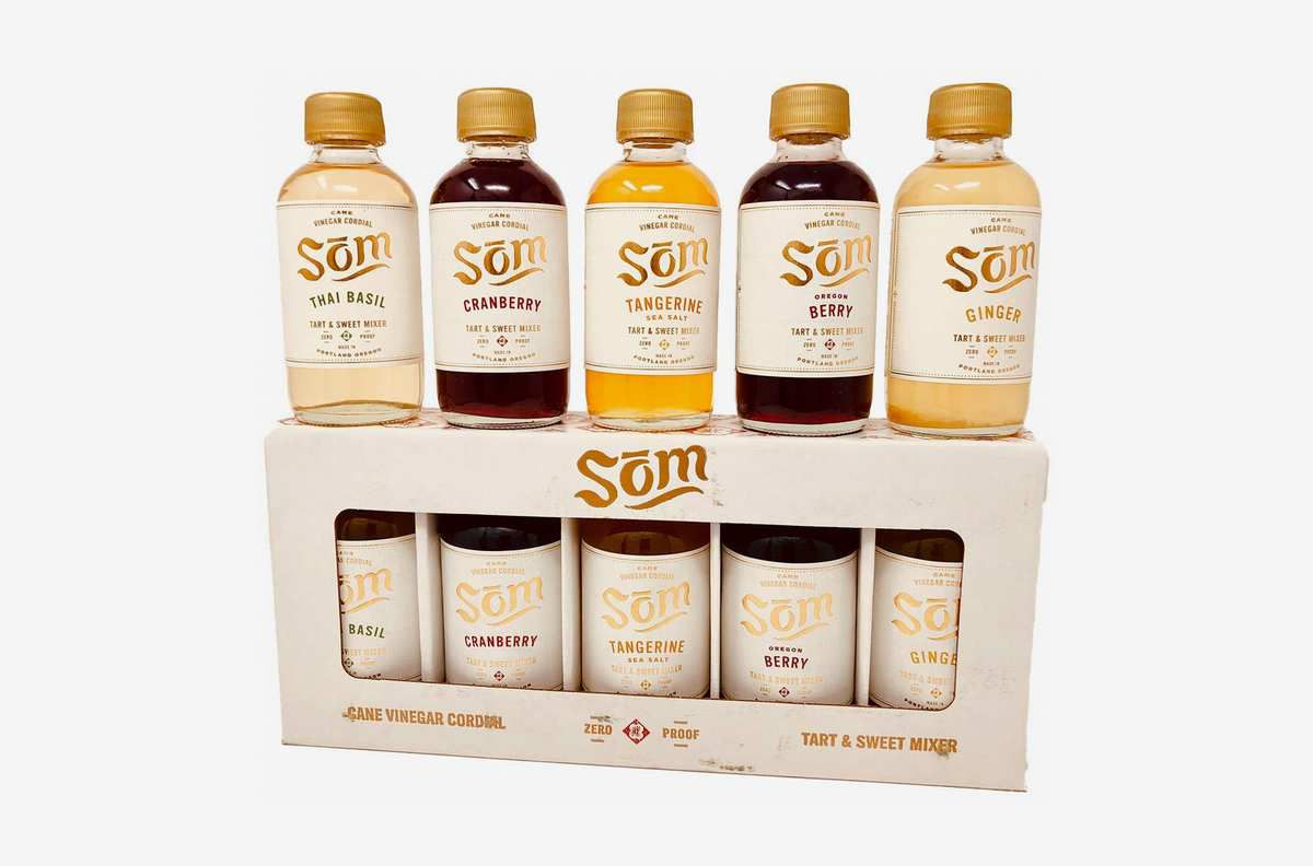 A Som sample set in a box with additional Som bottles on top of the box 