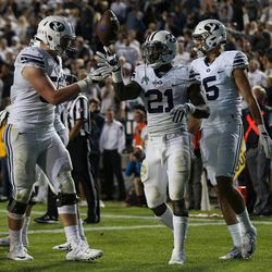 Brigham Young Cougars running back Jamaal Williams (21) celebrates after scoring a touchdown during a game against the Toledo Rockets at LaVell Edwards Stadium in Provo on Friday, Sept. 30, 2016.