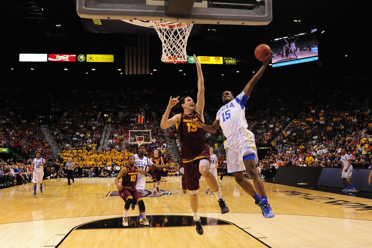 Shabazz dunks over ASU's 7'2" Center for the play of the game.  