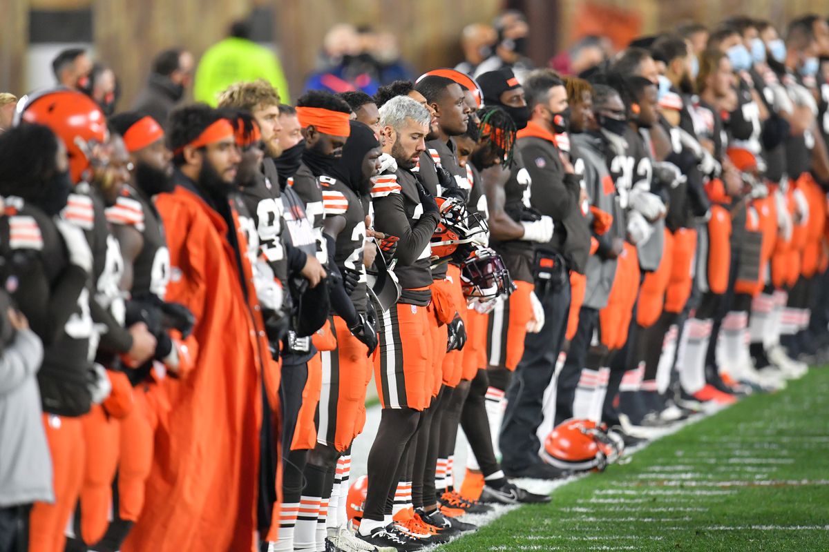 Cleveland Browns bow their heads during the national anthem prior to the game against the Baltimore Ravens at FirstEnergy Stadium on December 14, 2020 in Cleveland, Ohio.