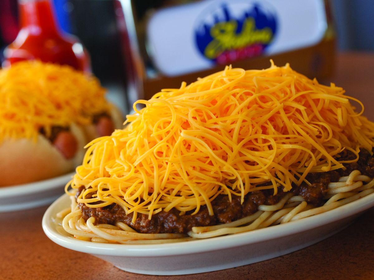 A close-up on a three-way with two coneys in the background.
