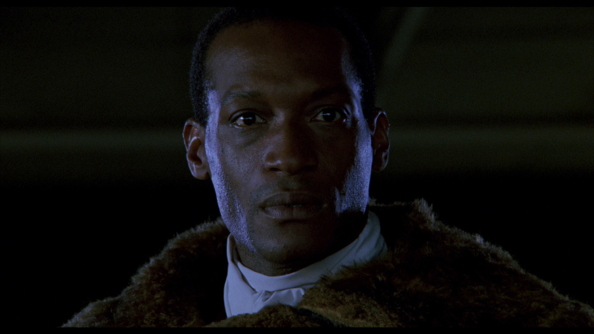 Tony Todd as Candyman in a furcoat staring intensely at someone off-screen.