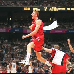 Britton Johnsen celebrates with his teammates following the Utes' semifinal win over North Carolina in the Final Four 1998 NCAA Division I Men's Basketball Tournament in San Antonio Saturday March 29, 1998.