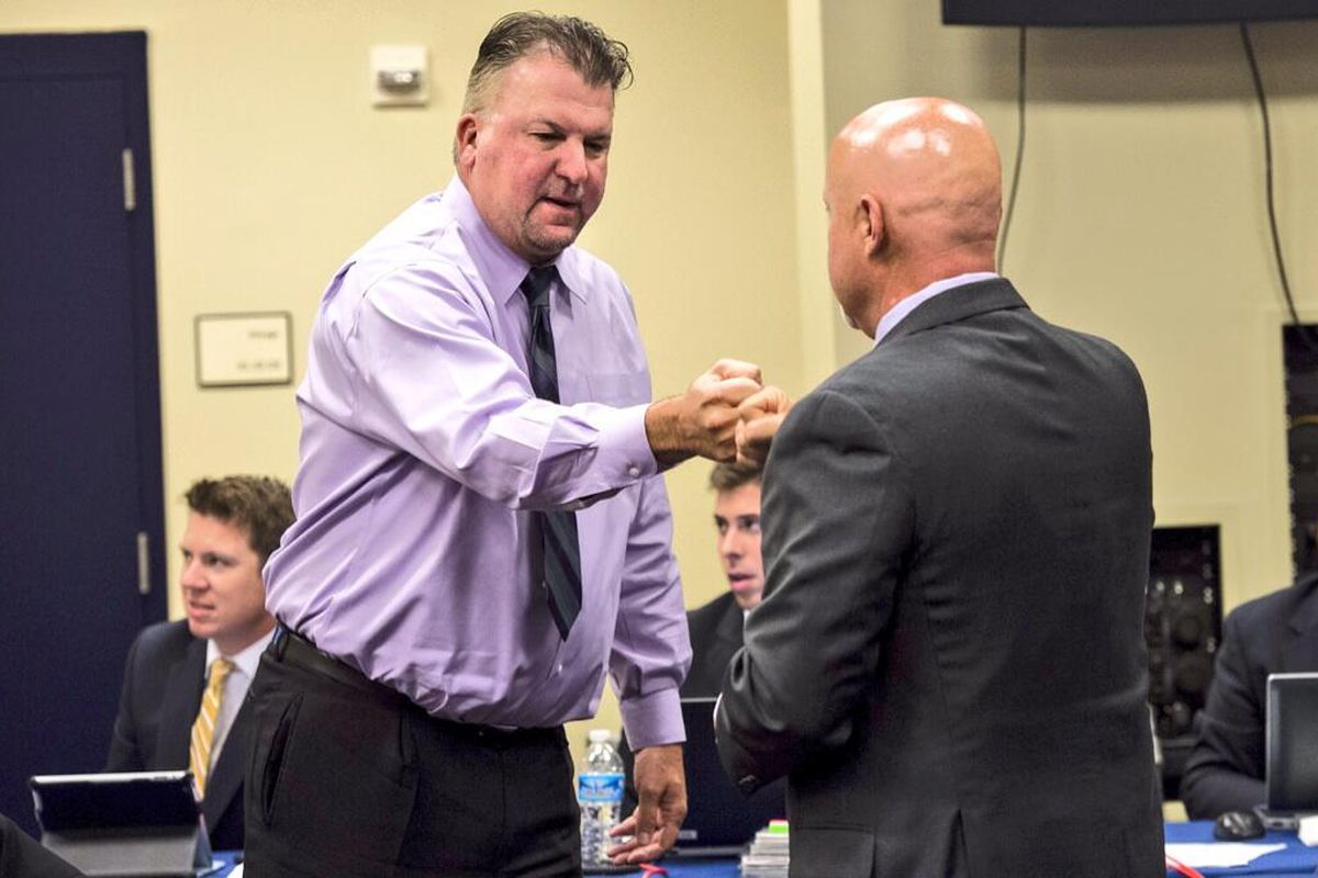 Nats' GM Mike Rizzo and Asst. GM Kris Kline fist bumb during the 2014 MLB Draft