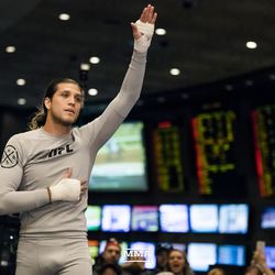 Brian Ortega salutes the crowd at UFC 222 workouts.