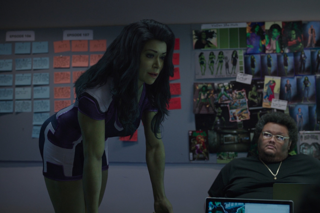 A scene from She-Hulk: Attorney at Law where the title character chats with the writers of her show in the real world.