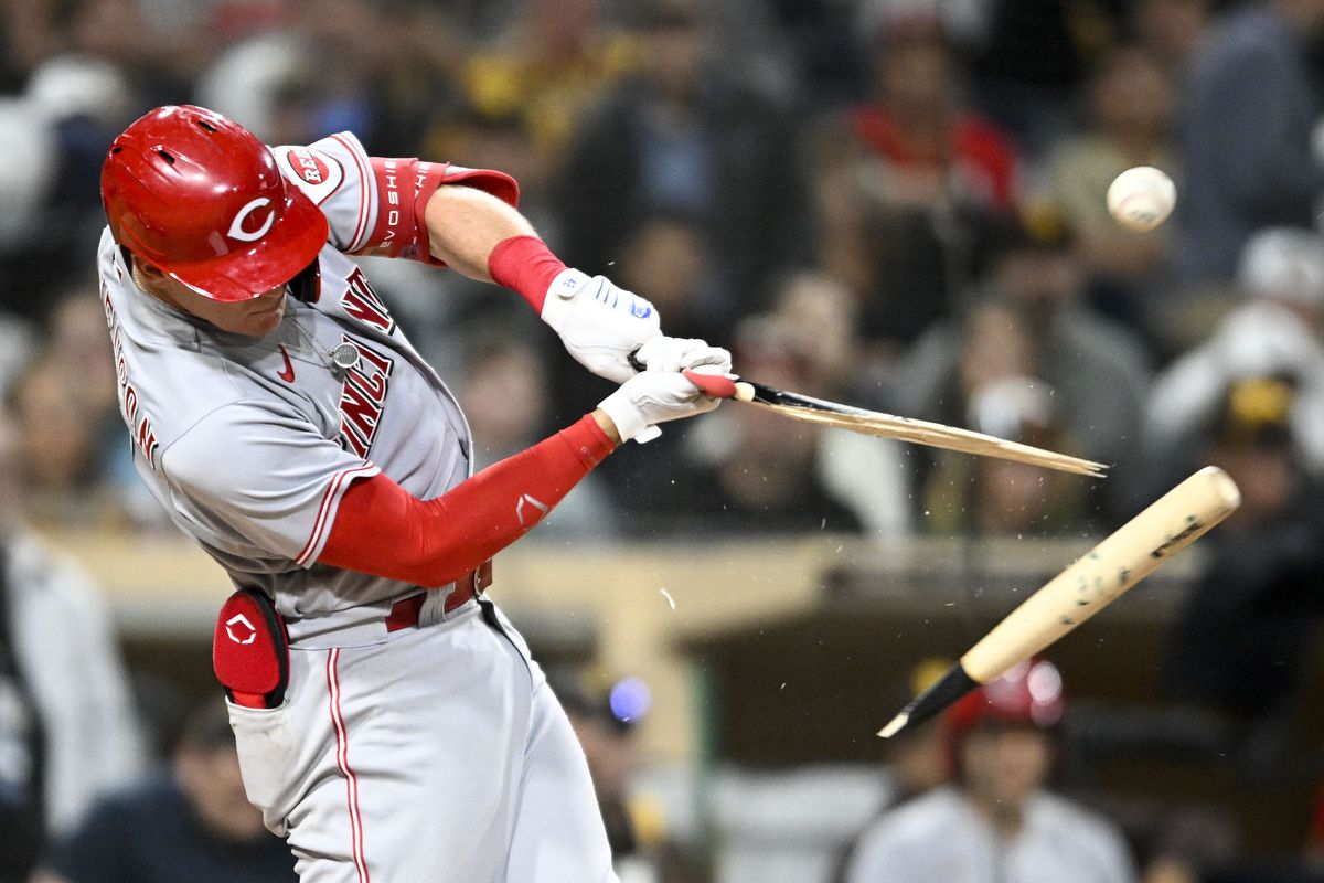 Tyler Stephenson #37 of the Cincinnati Reds breaks his bat as he flies out during the fifth inning of a baseball game against the Cincinnati Reds at Petco Park on April 18, 2022 in San Diego, California.