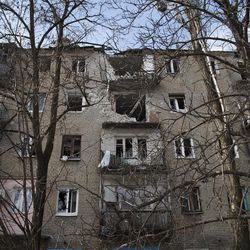 A damaged apartment building in Debaltseve, Ukraine, Friday, Feb. 20, 2015. After weeks of relentless fighting, the embattled Ukrainian rail hub of Debaltseve fell Wednesday to Russia-backed separatists, who hoisted a flag in triumph over the town. The Ukrainian president confirmed that he had ordered troops to pull out and the rebels reported taking hundreds of soldiers captive.