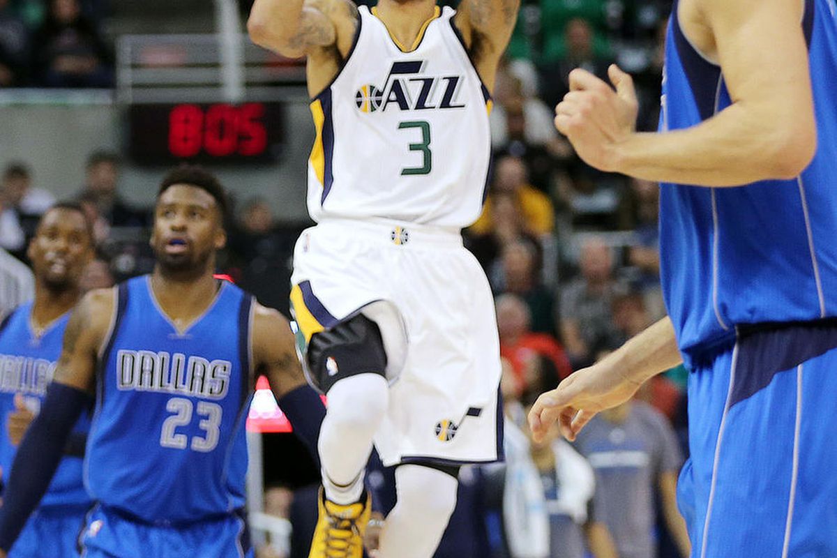 Utah Jazz guard George Hill (3) hits a three pointer against Dallas to end the first half during NBA basketball in Salt Lake City on Wednesday, Nov. 2, 2016.