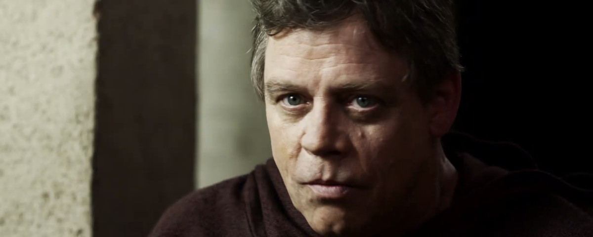 The Monk (Mark Hamill), a mystical video game guru figure, stares at the screen in close-up in Virtually Heroes