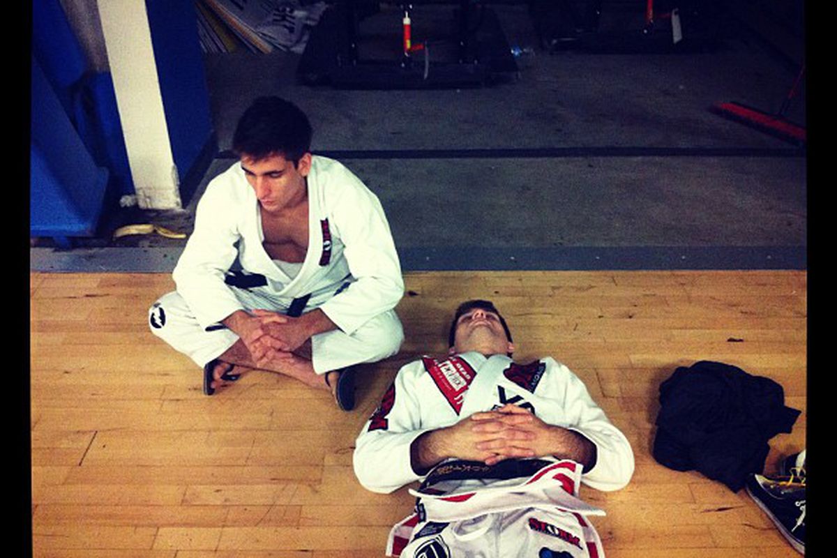 Guilherme Mendes and Rafael Mendes rest before their bouts. Photo taken by<a href="http://instagr.am/p/LZxOwIktGg/" target="new"> Stuart Cooper</a>.