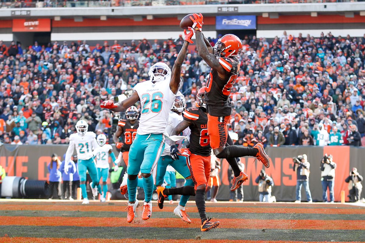 Jarvis Landry of the Cleveland Browns catches a pass for a touchdown over the defense of Steven Parker of the Miami Dolphins during the second quarter at FirstEnergy Stadium on November 24, 2019 in Cleveland, Ohio.