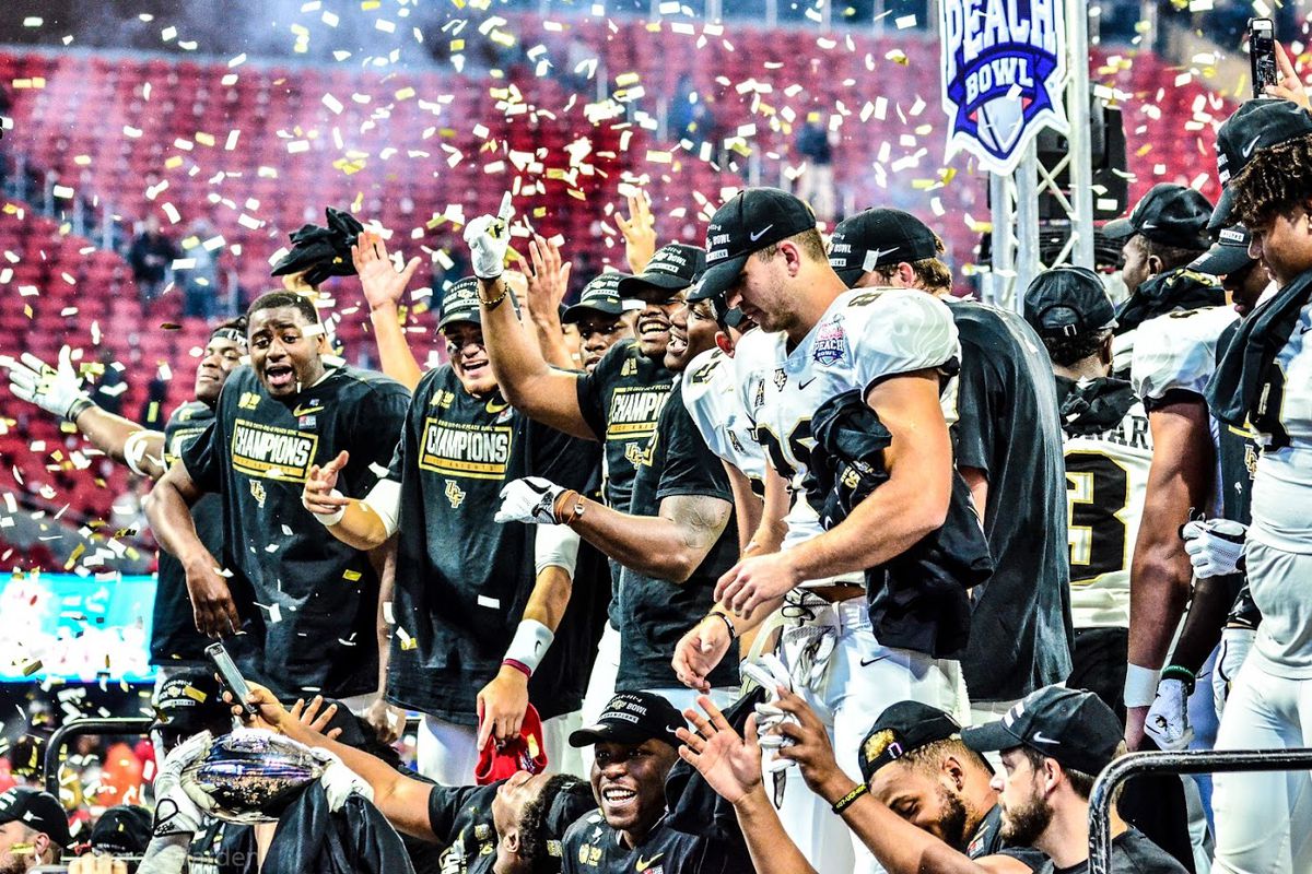 The UCF Knights celebrate their Peach Bowl victory -- and national championship -- in Atlanta on Jan. 1. (Photo: Derek Warden)