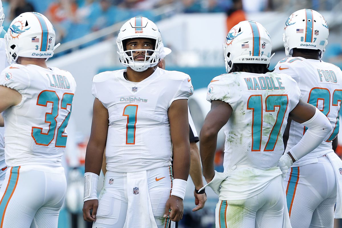 Tua Tagovailoa #1 of the Miami Dolphins in the huddle during the first half against the Carolina Panthers at Hard Rock Stadium on November 28, 2021 in Miami Gardens, Florida.