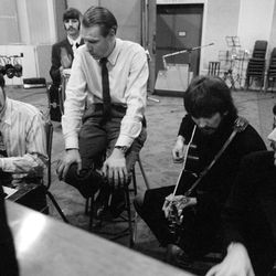 From left, John Lennon, Ringo Starr (in back), producer George Martin, George Harrison and Paul McCartney work on a Beatles album in the new documentary "Soundbreaking," now on Blu-ray and DVD.