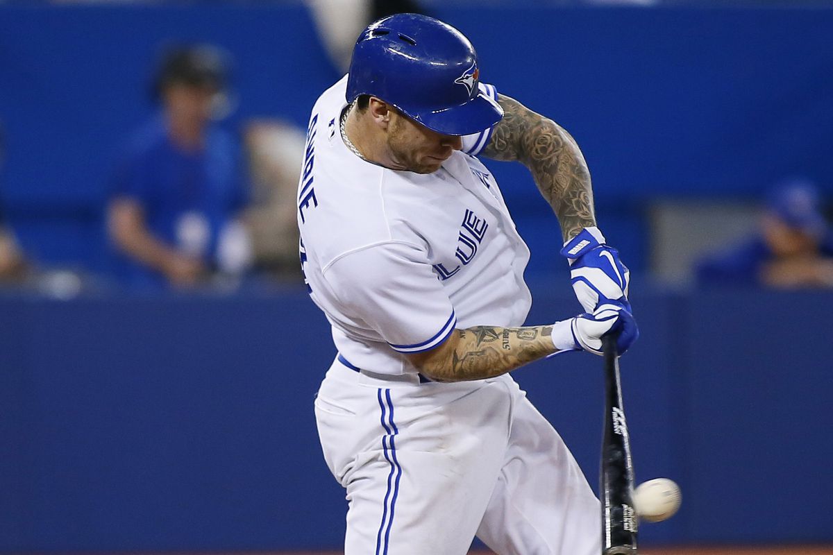 Elusive photographic evidence of a Toronto Blue Jay hitting a baseball