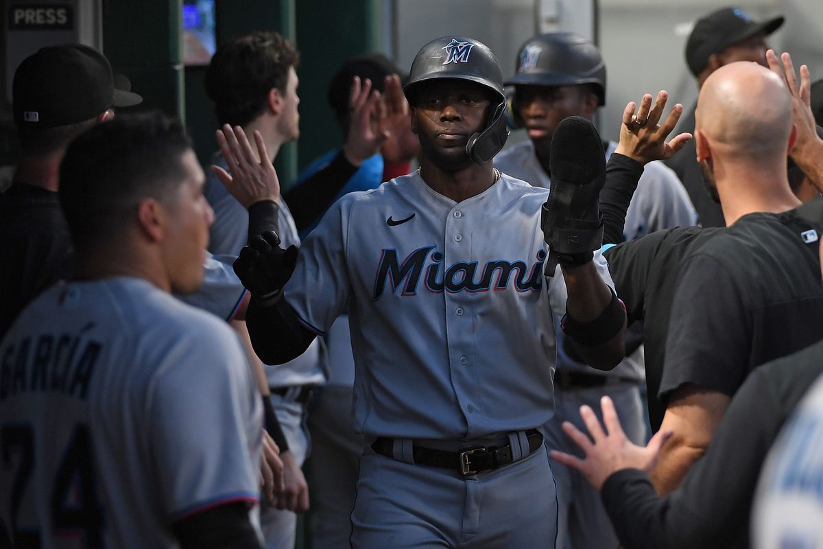 Jorge Soler #12 of the Miami Marlins celebrates with teammates in the dugout after coming around to score on a two run RBI double by Nick Fortes #54 in the sixth inning during the game against the Pittsburgh Pirates at PNC Park on July 22, 2022 in Pittsburgh, Pennsylvania.