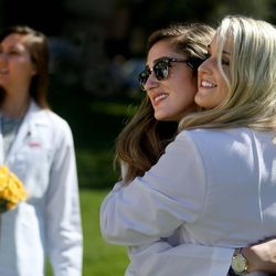 Angelina Schwartz, left, Evangelia Lazaris and Meredith Gaufin celebrate after the White Coat Ceremony at the University of Utah's Kingsbury Hall in Salt Lake City on Friday, Aug. 28, 2015. The class of 2019 has 122 medical students and is the first to receive and be directly affected by the Legislature's support of the medical school class size expansion. 