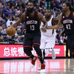 Houston Rockets guard James Harden (13) and center Nene Hilario (42) move down court during the game against the Utah Jazz at Vivint Smart Home Arena in Salt Lake City on Tuesday, Nov. 29, 2016.