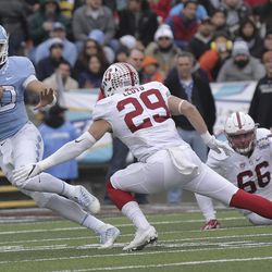 North Carolina quarterback Mitch Trubisky tries to get past Stanford safety Dallas Lloyd in the second quarter of the Sun Bowl NCAA college football game Friday, Dec., 30, 2016 in El Paso, Texas. 