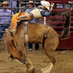 Tyler Waltz rides in the bareback portion of the Days of 47 Rodeo Tuesday, July 22, 2014, at EnergySolutions Arena in Salt Lake City.
