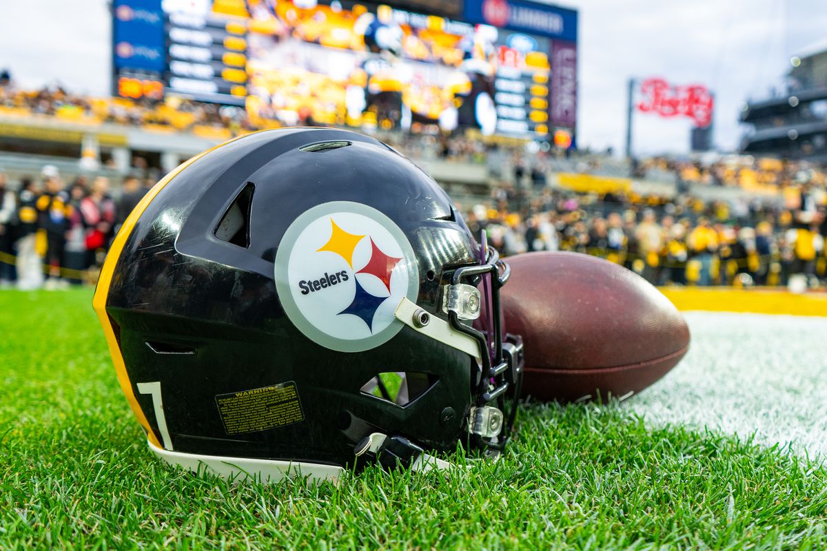A detailed view of a Pittsburgh Steelers helmet and football during the regular season NFL football game between the Cincinnati Bengals and Pittsburgh Steelers on December 23, 2023 at Acrisure Stadium in Pittsburgh, PA.