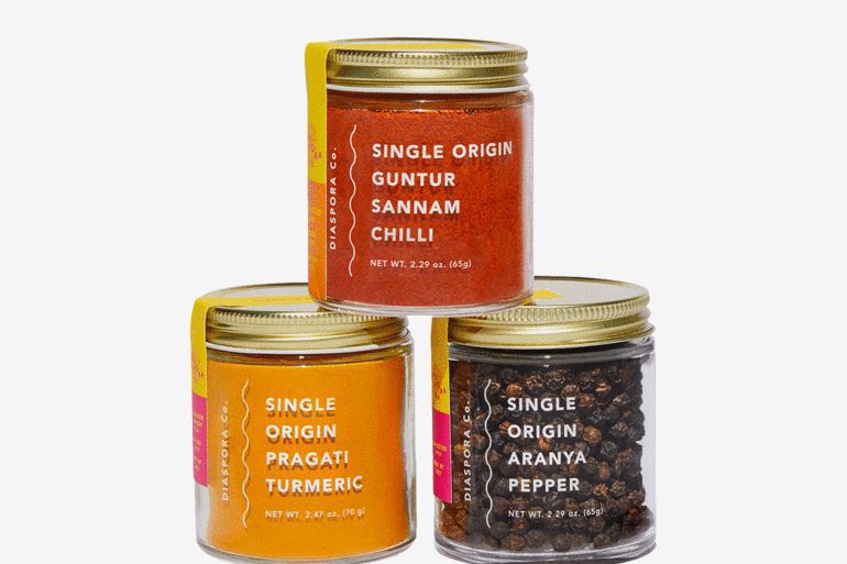 A set of three jars of spices that includes pragati turmeric, guntur sannam chilli, and aranya pepper