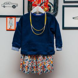 Pipit Jumper, <a href="http://www.caramel-shop.co.uk/pipitbabyjumper-navy-6m.html"> $99</a>. Sooty Skirt, <a href="http://www.caramel-shop.co.uk/sootyskirt-navypaintedflowerprint-8y.html"> $113</a>. 