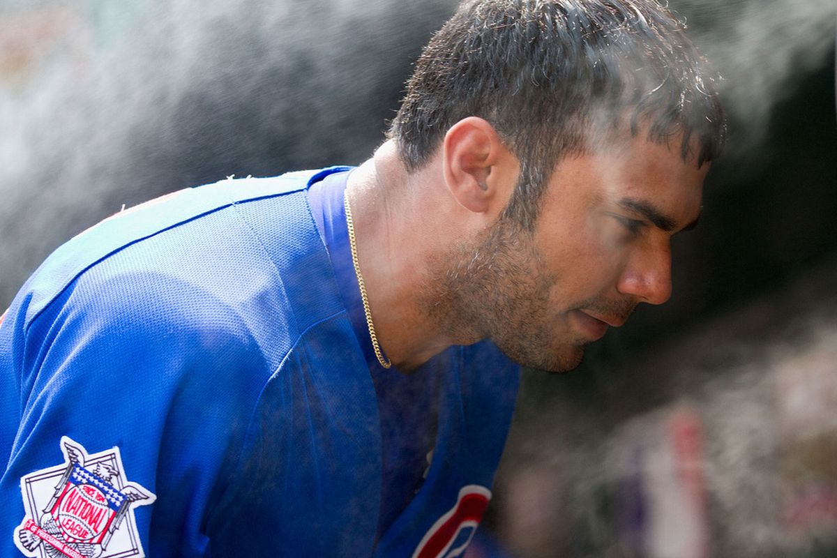 Carlos Pena of the Chicago Cubs cools off in the dugout against the St. Louis Cardinals at Busch Stadium on June 5, 2011 in St. Louis, Missouri.  The Cardinals beat the Cubs 3-2 in 10 innings.  (Photo by Dilip Vishwanat/Getty Images)