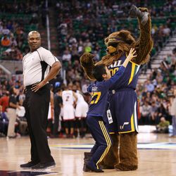Bear taunts a young Jazz fan in Salt Lake City on Thursday, Dec. 1, 2016. Miami won 111-110.