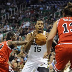 Utah Jazz power forward Derrick Favors (15) is fouled by Chicago Bulls small forward Tony Snell (20) going to the basket during a game at EnergySolutions Arena on Monday, Nov. 25, 2013.