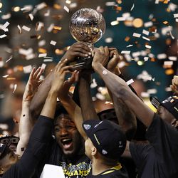 Oregon Ducks players celebrate winning the Pac-12 conference tournament championship game over the Utah Utes at the MGM Grand Garden Arena in Las Vegas, Saturday, March 12, 2016.