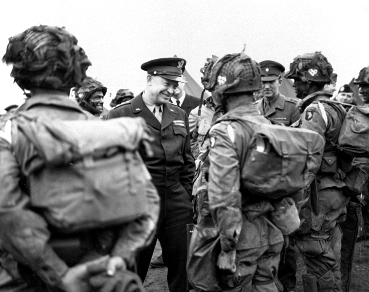 FILE - In this June 6, 1944, file photo, provided by the U.S. Army Signal Corps, General Dwight Eisenhower gives the order of the day, "Full Victory - Nothing Else" to paratroopers in England just before they board their planes to participate in the first