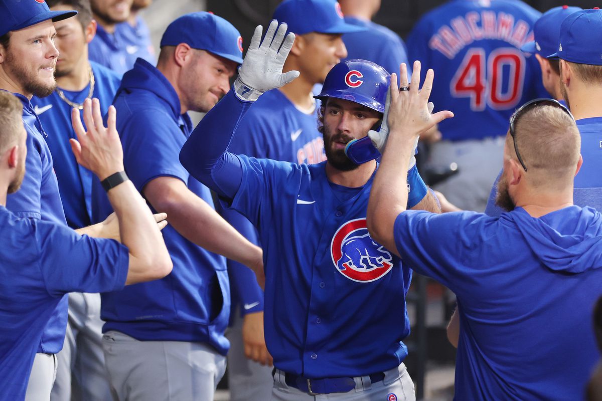 Dansby Swanson #7 of the Chicago Cubs high fives teammates after hitting a solo home run off Michael Kopech #34 of the Chicago White Sox (not pictured) during the fourth inning at Guaranteed Rate Field on July 25, 2023 in Chicago, Illinois.