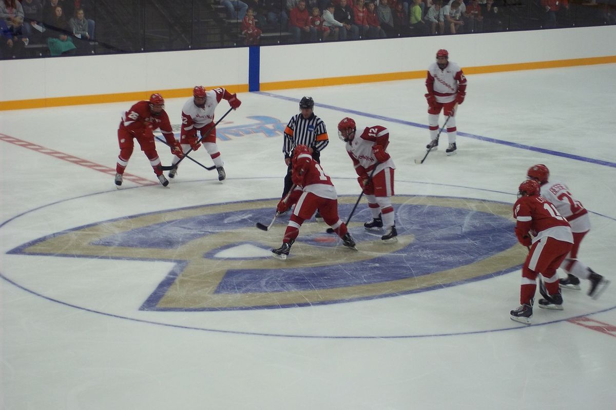 Eau Claire native Jefferson Dahl takes a faceoff for Team Red at the scrimmage.