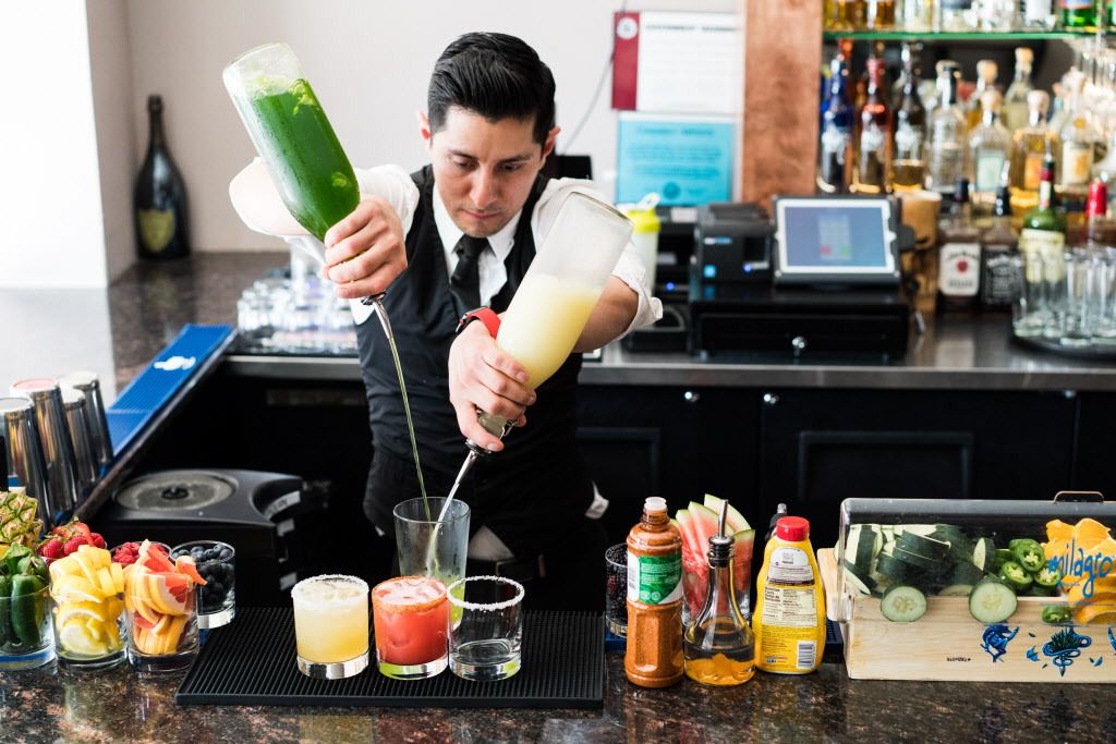 Uriel Gonzalez, the head bartender at Del Toro, prepares a trio of margaritas at the Pilsen bar/eatery on May 2, 2018. | Max Herman/For the Sun-Times
