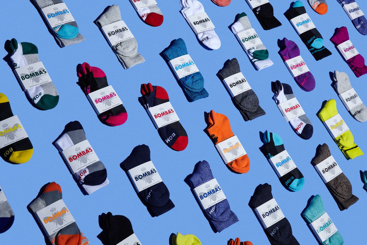 a bunch of colorful bombas socks