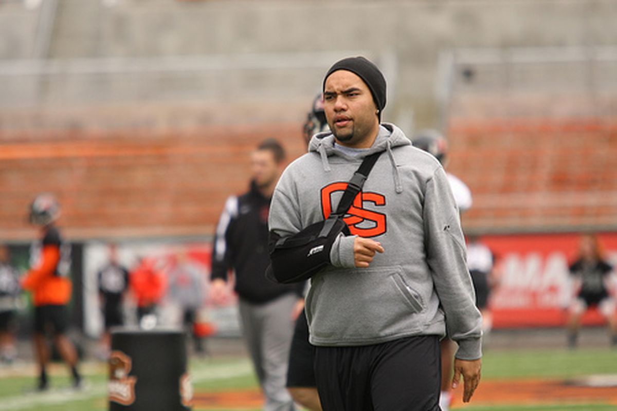 Senior quarterback Lyle Moevao, who watched Spring Practice in a sling, was cleared to begin throwing on Tuesday by doctors. (Photo by Ethan Erickson)