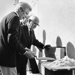 Arthur Moore hands a trowel to President Spencer W. Kimball at the cornerstone ceremony in Aug. 1981.