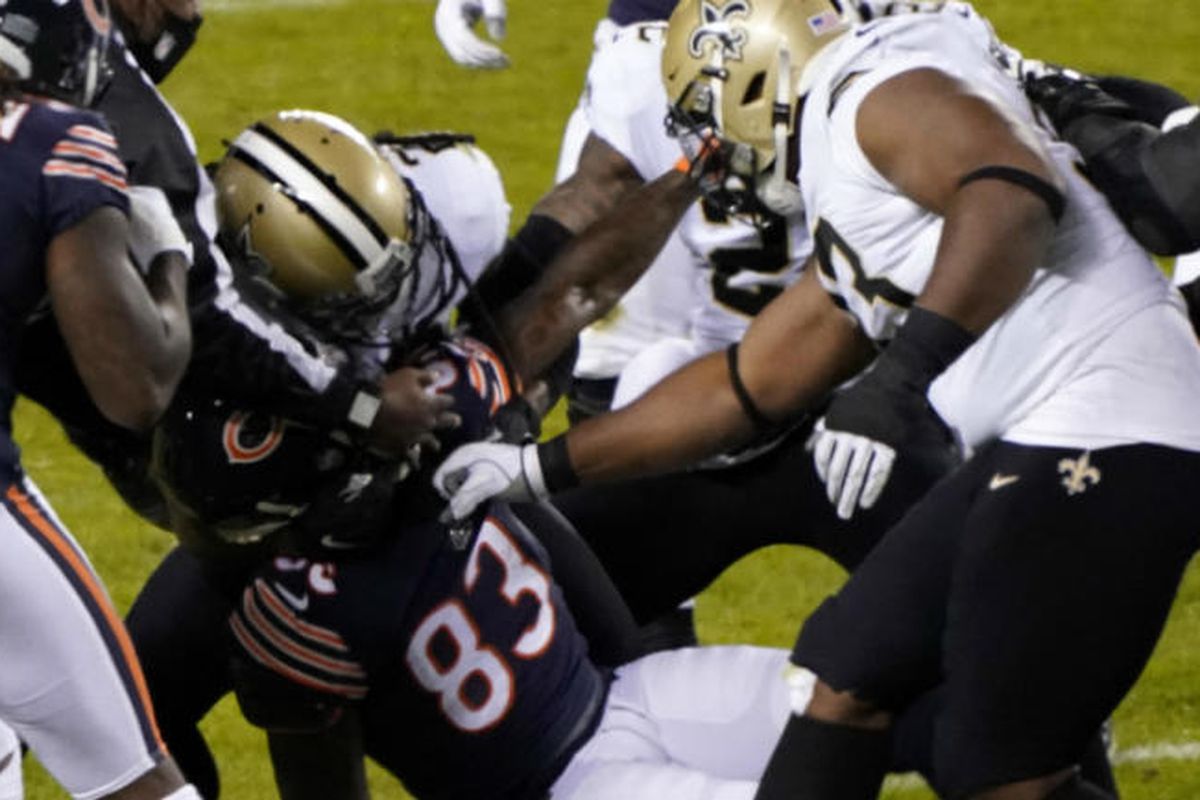 Saints players wrestle with Bears wide receiver Javon Wims (83) after he punched New Orleans’ Chauncey Gardner-Johnson on Sunday at Soldier Field.